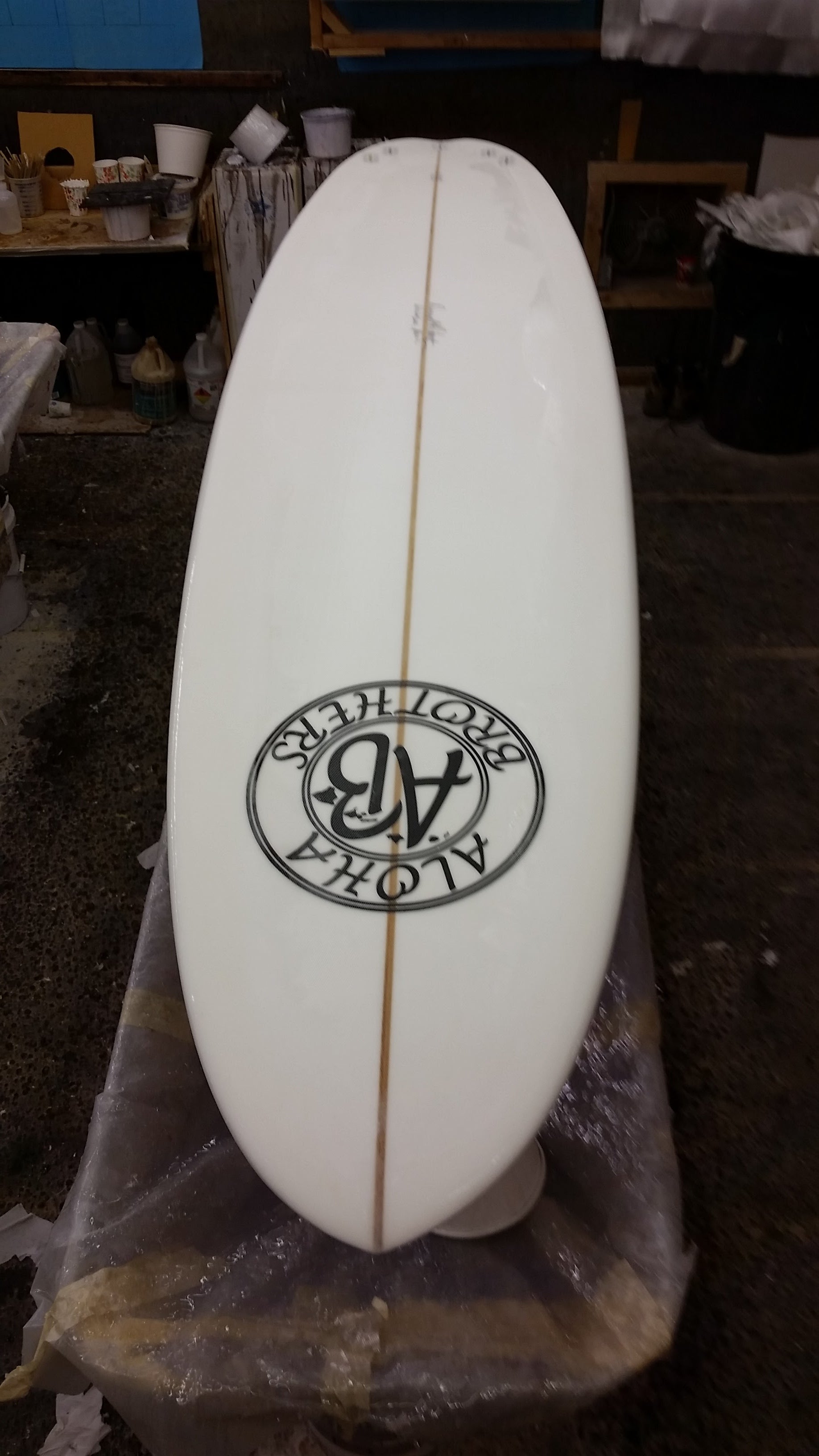 Poly laminating clear or colored surfboards